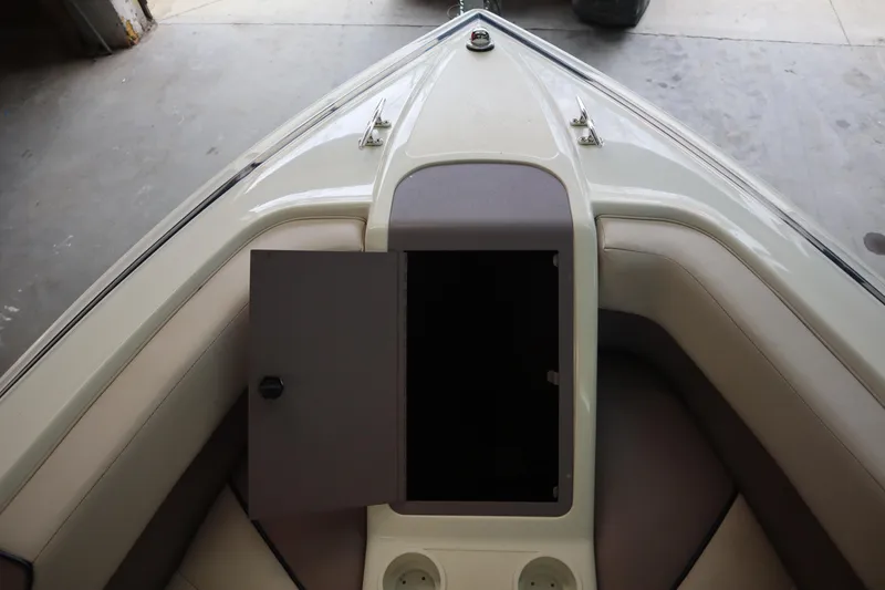 Slide: The Image of Bow of 1996 Cobalt 220 boat with open storage compartment. - 19