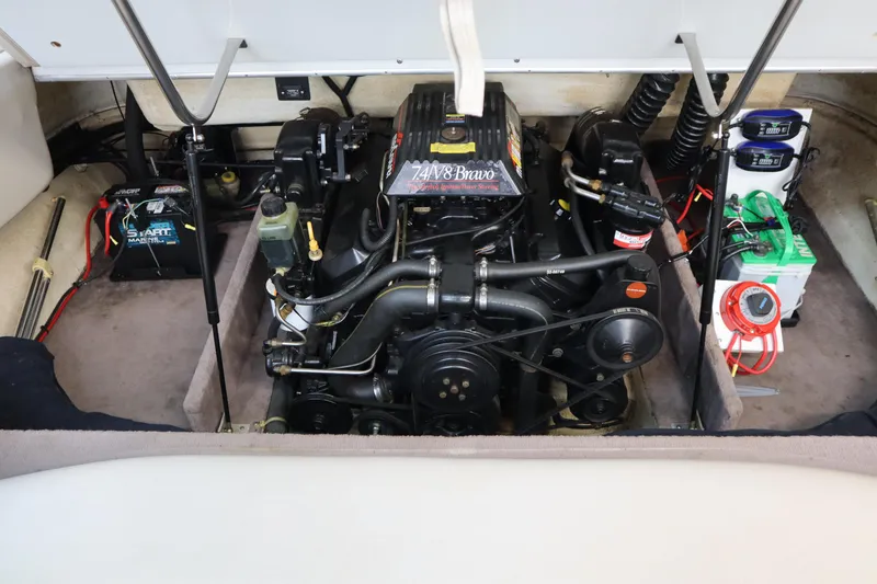 Slide: The Image of Engine compartment of a 1996 Cobalt 220 boat, featuring a well-maintained motor and battery setup. - 20