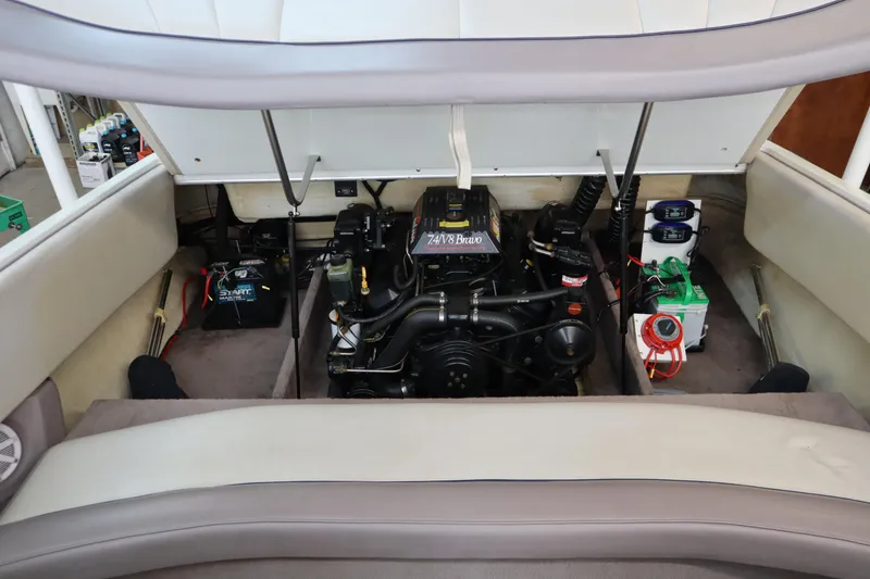 Slide: The Image of Engine compartment of a 1996 Cobalt 220 boat, showcasing the engine and battery setup. - 21