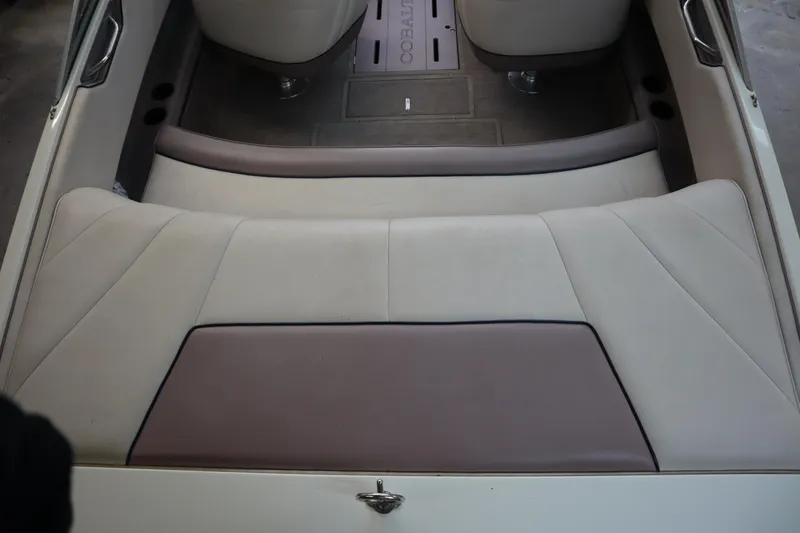 Slide: The Image of Interior of a 1996 Cobalt 220 boat with beige and brown seating. - 6