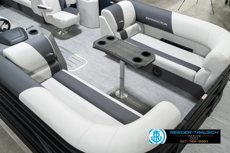 Slide: The Image of 2025 Bennington 22 SSR pontoon boat interior with gray and white seating and a central table. - 13
