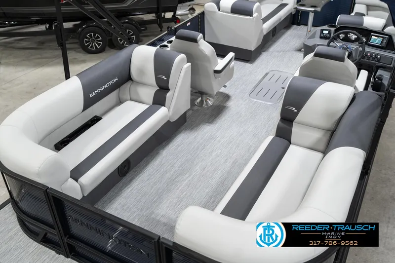 Slide: The Image of 2025 Bennington 22 SSR pontoon boat interior with gray and white seating, spacious layout. - 14