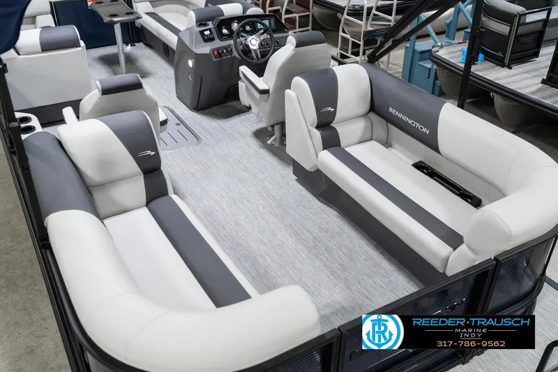 Slide: The Image of 2025 Bennington 22 SSR pontoon boat interior with plush seating and modern dashboard. - 15