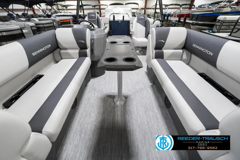 Slide: The Image of 2025 Bennington 22 SSR pontoon boat interior with gray seating and cup holders. - 16