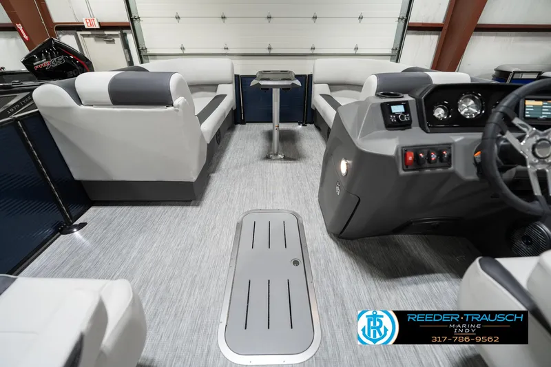 Slide: The Image of 2025 Bennington 22 SSR pontoon boat interior with modern seating and control panel. - 20