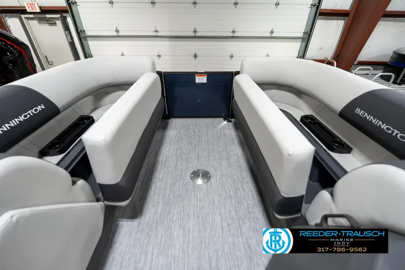 Slide: The Image of 2025 Bennington 22 SSR pontoon boat interior with gray seating and flooring. - 23
