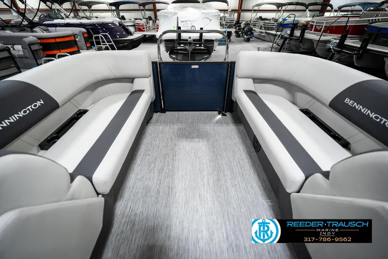 Slide: The Image of 2025 Bennington 22 SSR pontoon boat interior with gray seating in showroom. - 24