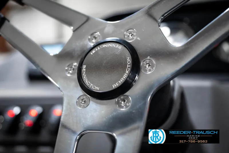 Slide: The Image of Steering wheel of 2025 Bennington 22 SSR boat, featuring sleek metallic design. - 30