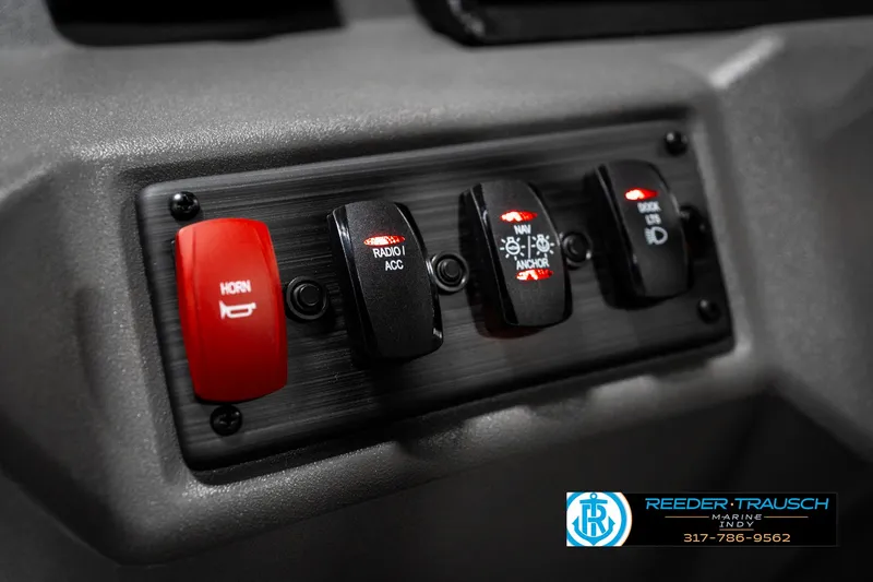 Slide: The Image of Control panel of 2025 Bennington 22 SSR boat with labeled switches. - 31