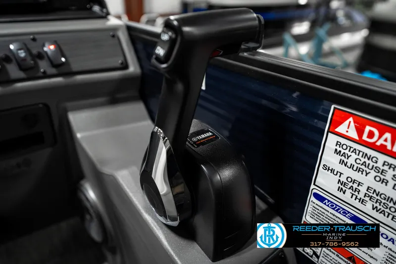 Slide: The Image of 2025 Bennington 22 SSR boat throttle control with warning label and Reeder-Trausch branding. - 36