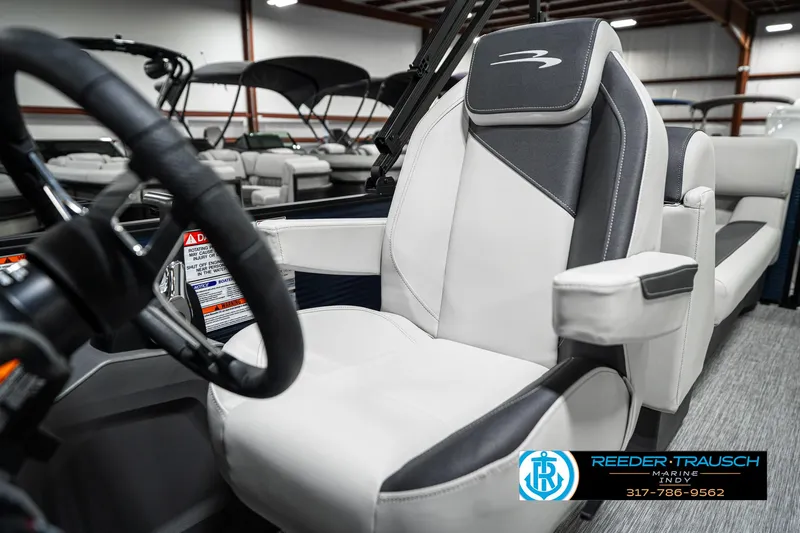 Slide: The Image of 2025 Bennington 22 SSR boat interior with modern seating and steering wheel. - 37