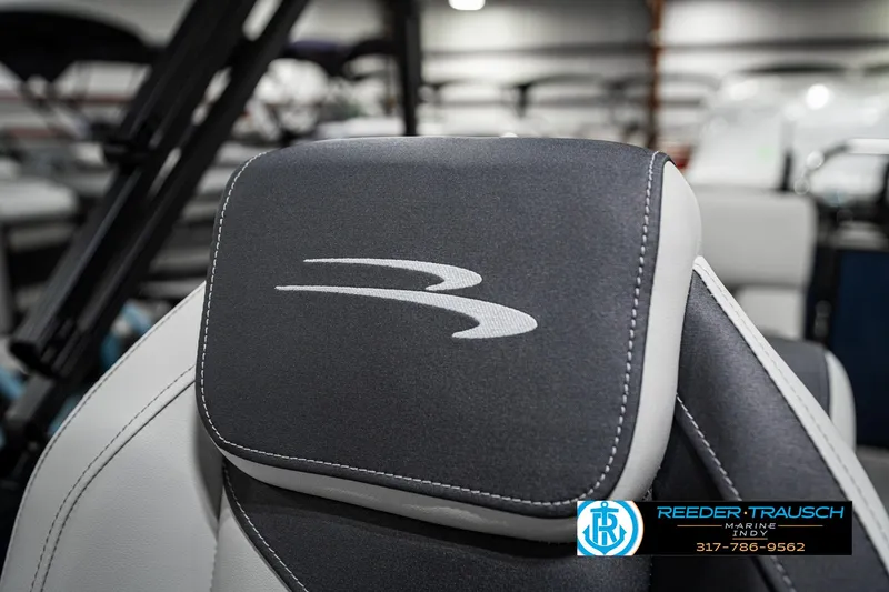 Slide: The Image of 2025 Bennington 22 SSR boat seat with logo, featuring sleek gray and white design. - 38