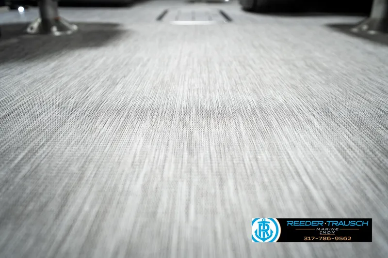 Slide: The Image of 2025 Bennington 22 SSR boat flooring with textured gray surface, Reeder-Trausch Marine logo visible. - 43