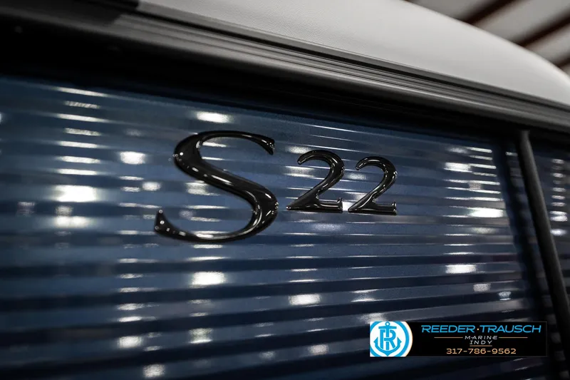 Slide: The Image of 2025 Bennington 22 SSR boat with "S22" emblem on blue panel. - 46