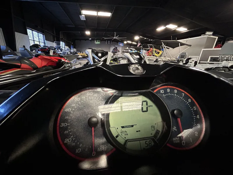 Slide: The Image of Dashboard view of a 2011 Sea-Doo GTI Limited 155 in a showroom setting. - 5