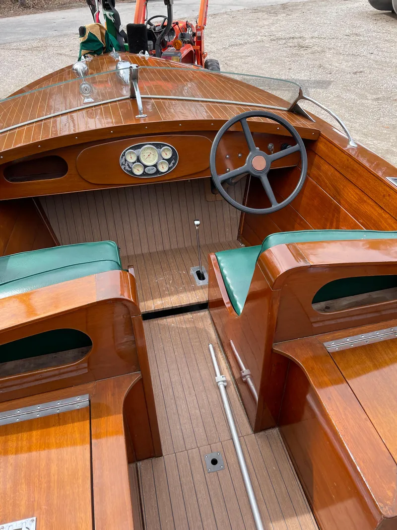 Slide: The Image of 1951 Hacker-Craft 22 Utility boat with wooden interior and green seats. - 4