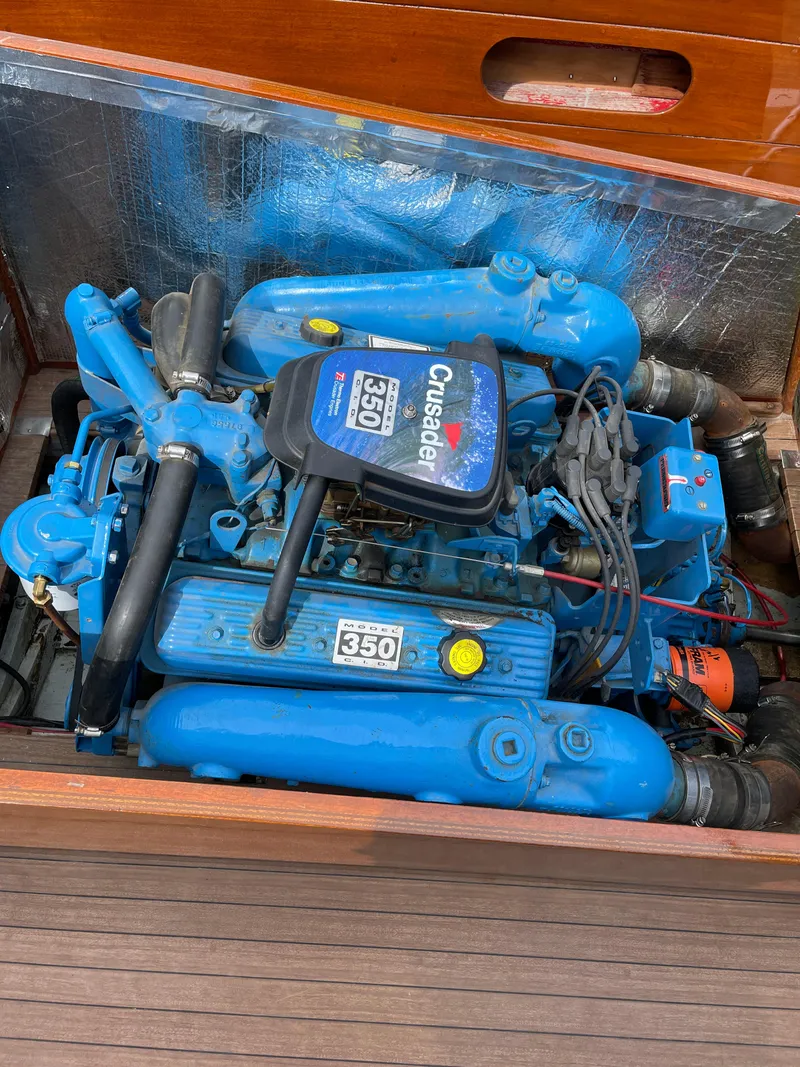 Slide: The Image of 1951 Hacker-Craft 22 Utility boat engine, blue Crusader 350, detailed view. - 5