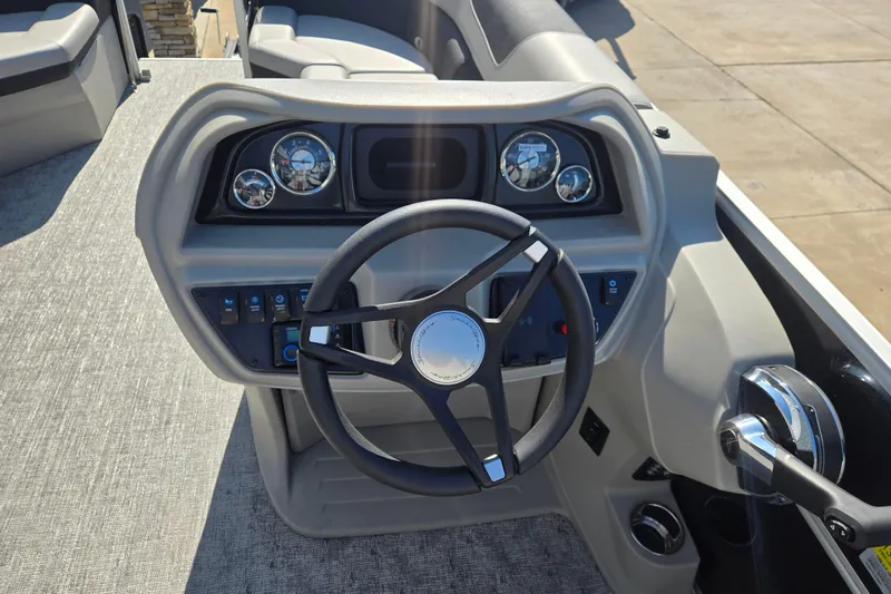 Slide: The Image of Steering console of 2025 South Bay 224RS LE boat with gauges and controls. - 7
