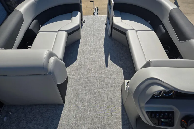 Slide: The Image of 2025 South Bay 224RS LE pontoon boat interior with luxurious seating and modern dashboard. - 8