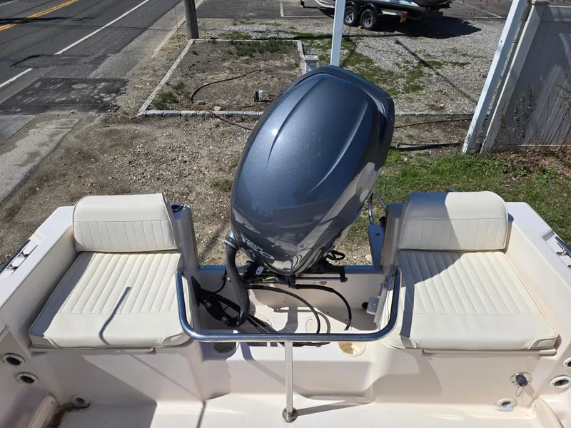 Slide: The Image of 2010 Grady-White Sportsman 180 boat with outboard motor and seating. - 2