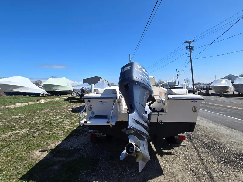 Slide: The Image of 2010 Grady-White Sportsman 180 boat with Yamaha outboard motor, parked outdoors. - 9