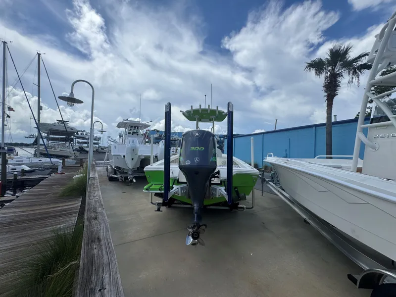 Slide: The Image of 2015 Pathfinder 2600 HPS boat docked, featuring a powerful 300 horsepower engine. - 10