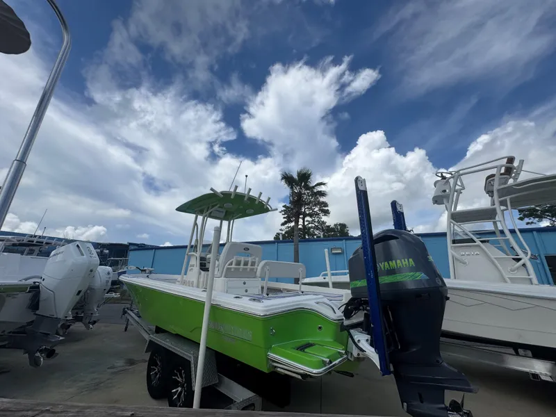 Slide: The Image of 2015 Pathfinder 2600 HPS boat with Yamaha engine, parked under a cloudy sky. - 11