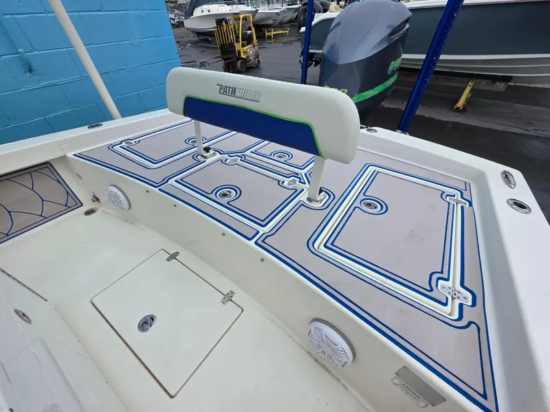 Slide: The Image of 2015 Pathfinder 2600 HPS boat deck with custom blue and white design. - 16