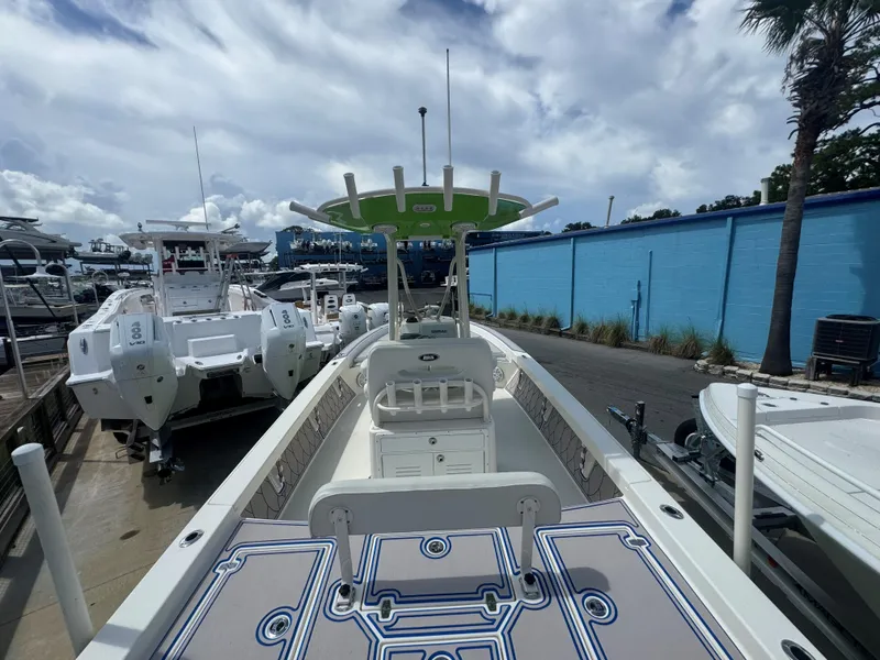 Slide: The Image of 2015 Pathfinder 2600 HPS boat docked, featuring spacious deck and modern design. - 19