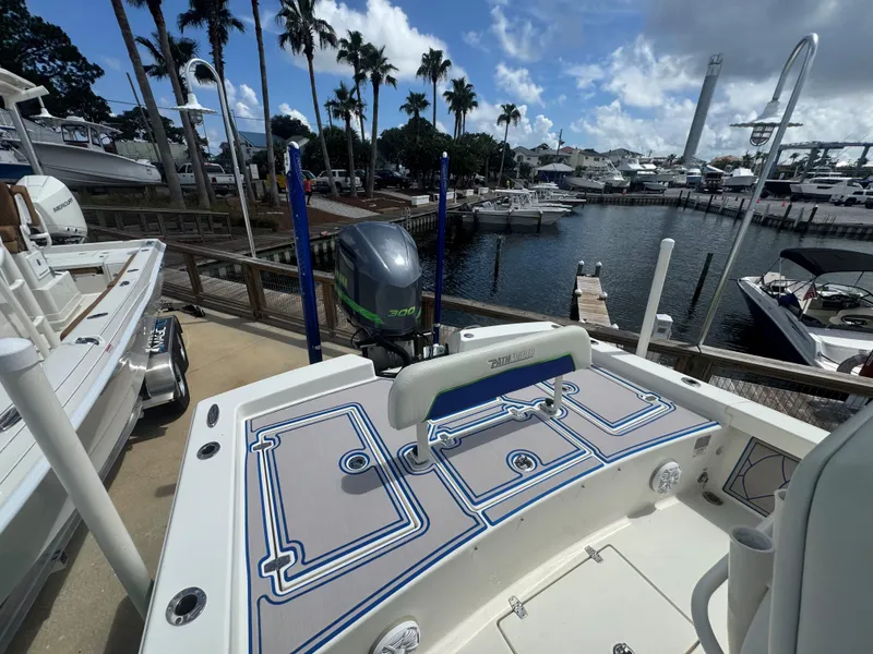 Slide: The Image of 2015 Pathfinder 2600 HPS boat docked at a marina with palm trees. - 24