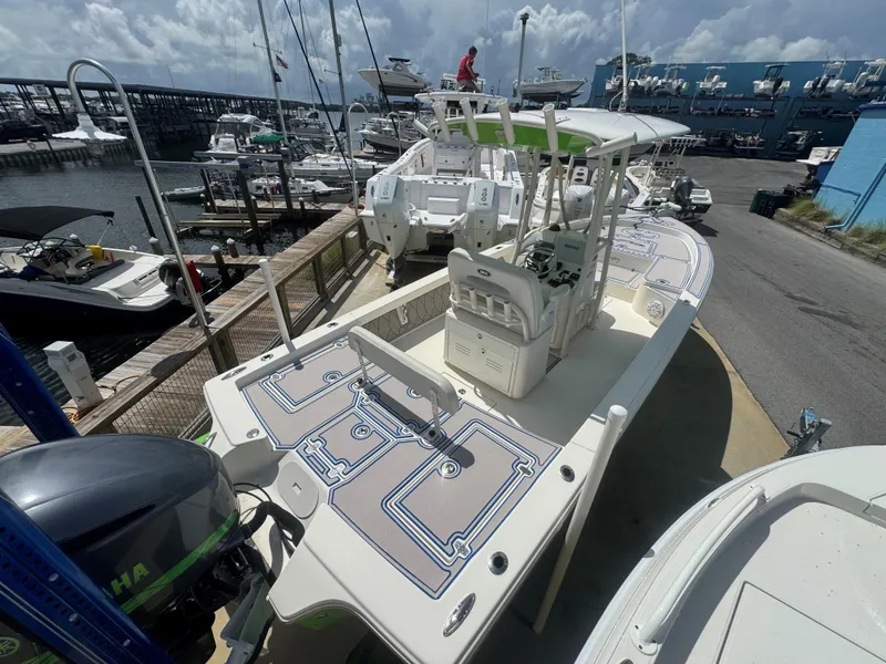 Slide: The Image of 2015 Pathfinder 2600 HPS boat docked at marina, featuring Yamaha outboard motor. - 26