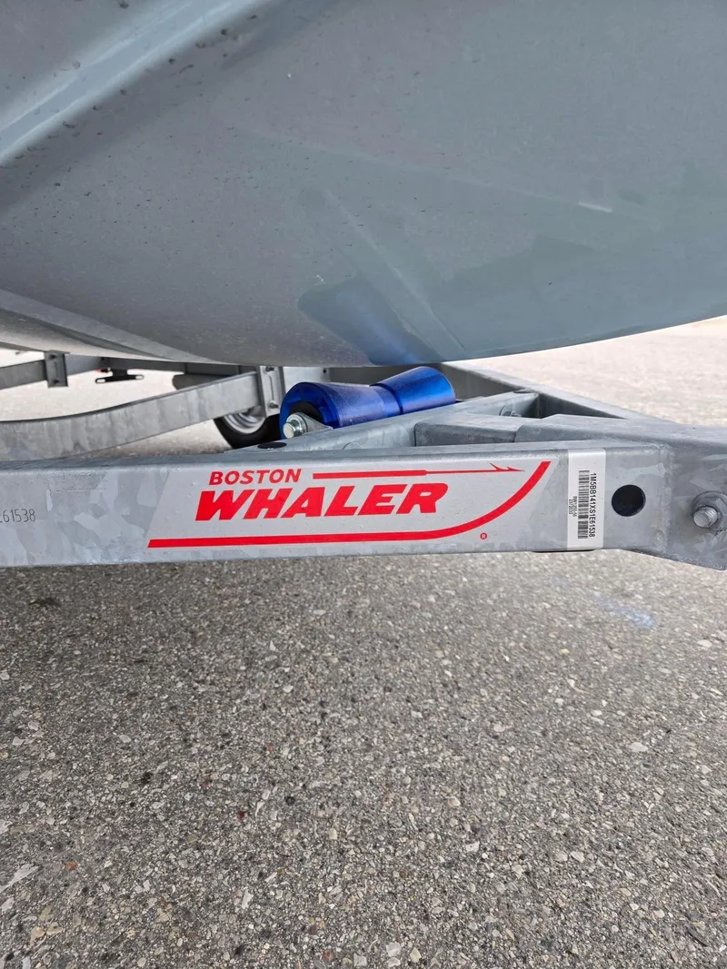 Slide: The Image of Trailer for 2025 Boston Whaler 130 Super Sport on pavement. - 10