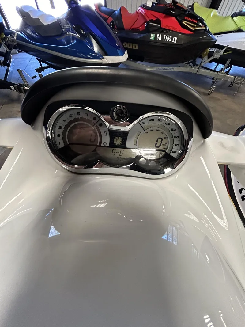 Slide: The Image of 2008 Sea-Doo RXT dashboard with speedometer and controls in a showroom setting. - 5