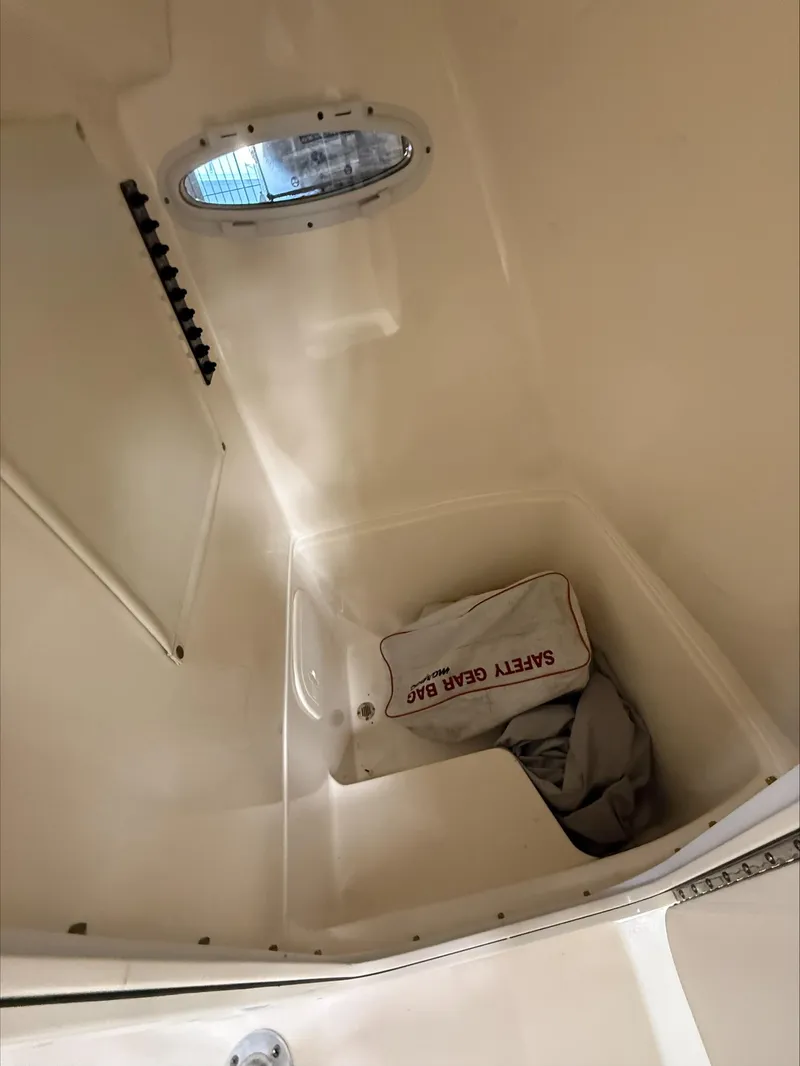 Slide: The Image of Interior of 2022 Cobia 237 CC boat with safety gear bag. - 7