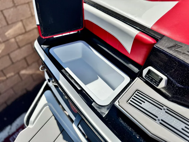 Slide: The Image of 2021 Malibu Wakesetter 25 LSV boat interior with open storage compartment. - 12