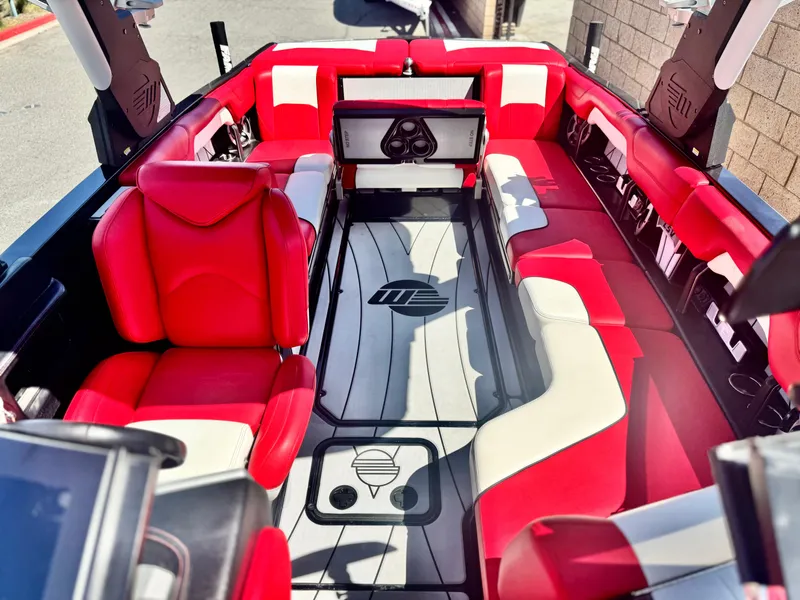 Slide: The Image of 2021 Malibu Wakesetter 25 LSV interior with red and white seating. - 19