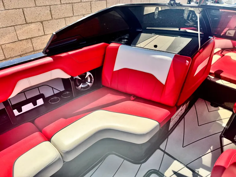 Slide: The Image of 2021 Malibu Wakesetter 25 LSV interior with red and white seating, modern design. - 20