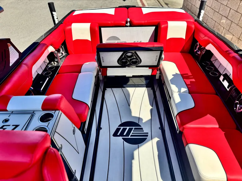 Slide: The Image of 2021 Malibu Wakesetter 25 LSV interior with red and white seating, sleek design, and modern features. - 24