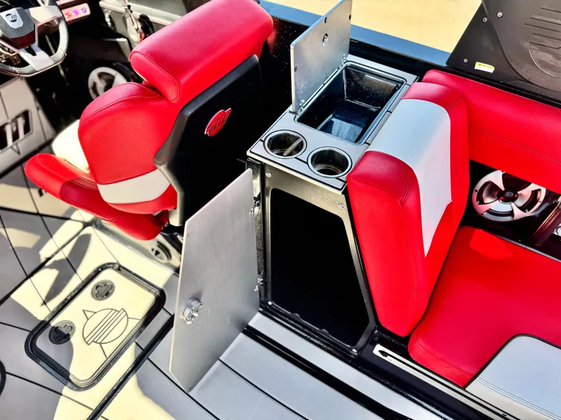 Slide: The Image of 2021 Malibu Wakesetter 25 LSV interior with red seats and cup holders. - 25