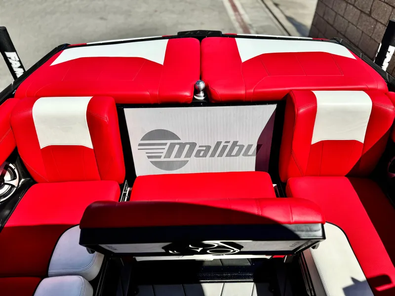 Slide: The Image of 2021 Malibu Wakesetter 25 LSV interior with red and white seating. - 26