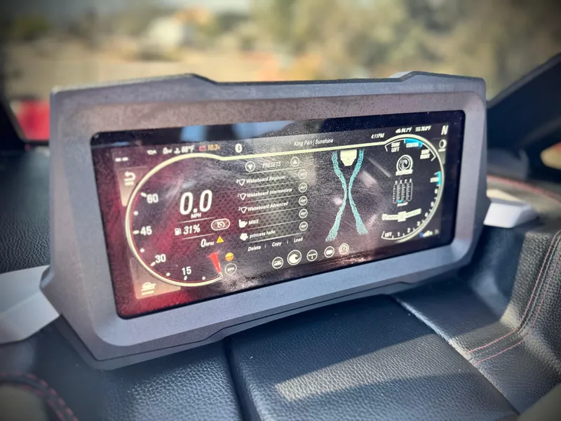 Slide: The Image of Dashboard display of a 2021 Malibu Wakesetter 25 LSV boat, showing speed and controls. - 42