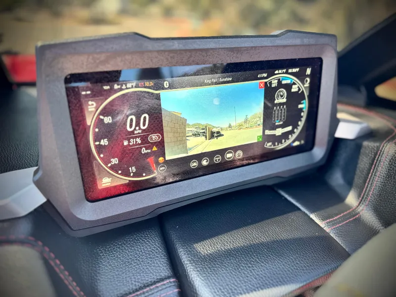 Slide: The Image of Dashboard display of 2021 Malibu Wakesetter 25 LSV, showing speed and rearview camera. - 43