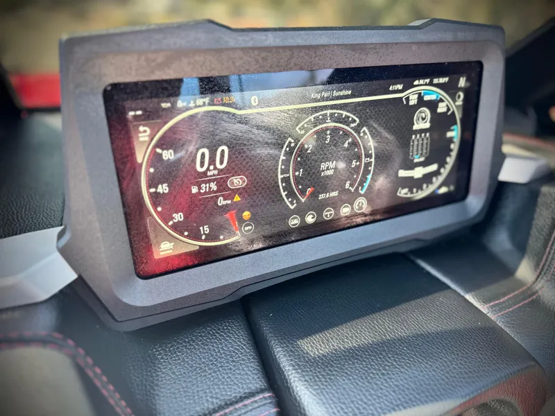 Slide: The Image of Dashboard display of 2021 Malibu Wakesetter 25 LSV showing speed and RPM gauges. - 44