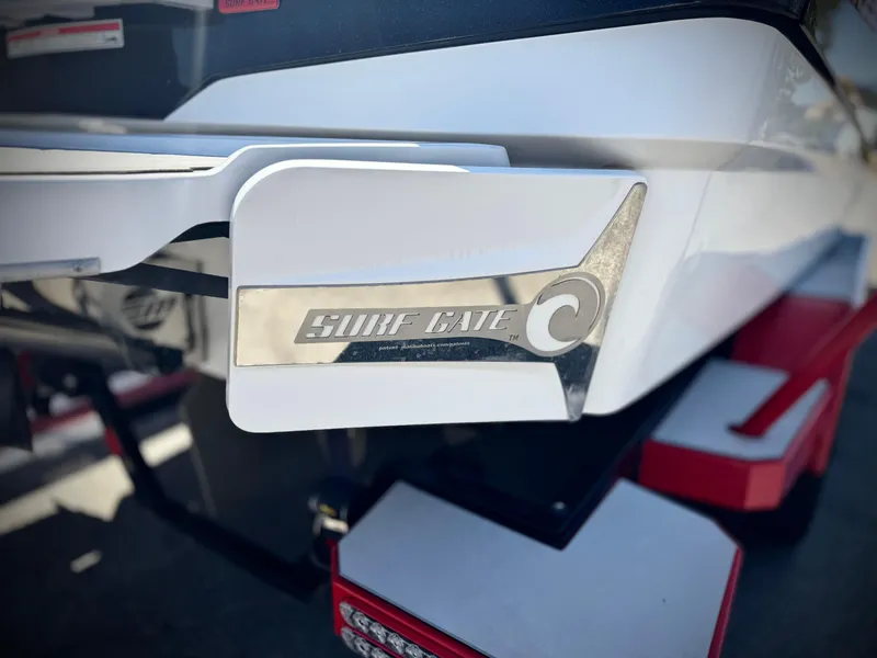 Slide: The Image of 2021 Malibu Wakesetter 25 LSV boat with Surf Gate feature, close-up view. - 9
