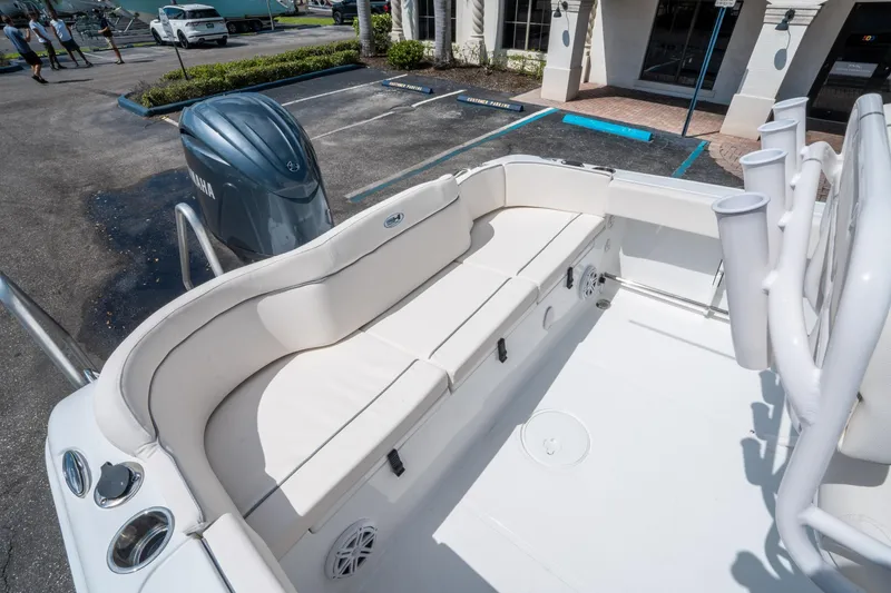 Slide: The Image of 2025 Sea Hunt Ultra 229 boat interior with seating and Yamaha engine. - 11