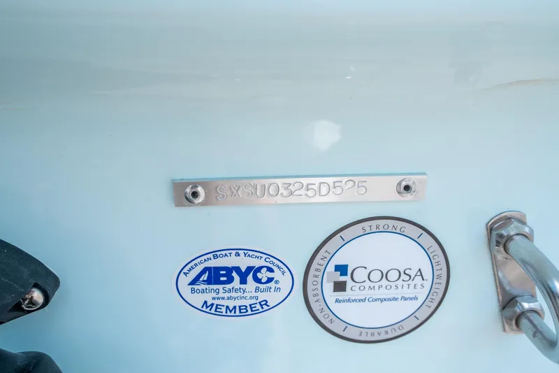 Slide: The Image of 2025 Sea Hunt Ultra 229 boat with ABYC and Coosa Composites labels. - 30