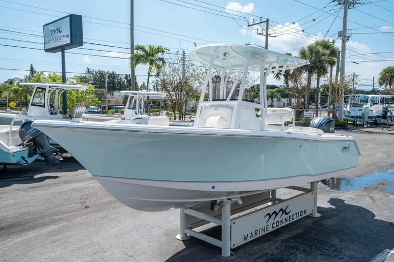 Slide: The Image of 2025 Sea Hunt Ultra 229 boat displayed at Marine Connection dealership. - 6