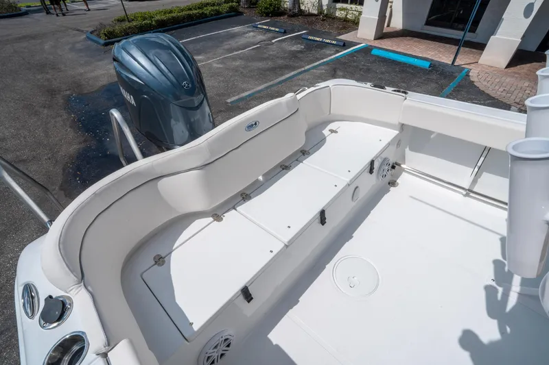 Slide: The Image of 2025 Sea Hunt Ultra 229 boat interior with seating and Yamaha outboard motor. - 13