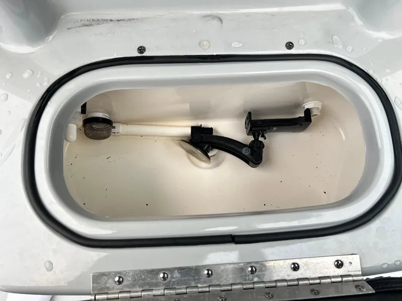 Slide: The Image of Livewell compartment in 2023 Avid 23 Mag boat, featuring plumbing and aeration system. - 10