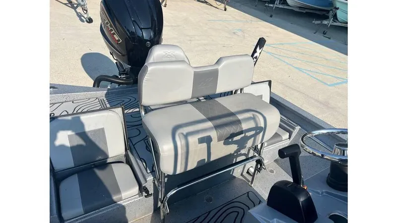 Slide: The Image of 2023 Express H22B boat interior with seating and motor, showcasing modern design and functionality. - 5